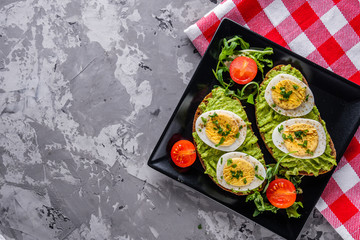 tasty and nutritious avocado sandwich and boiled egg