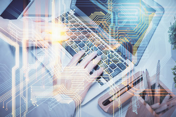 Double exposure of woman hands working on computer and world map hologram drawing. International technology business concept.