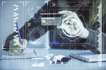 Double exposure of woman on-line shopping holding a credit card and data theme hologram drawing. E-commerce concept.