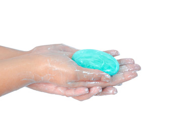 Close up of washing hands with soap with red corona virus isolated on white background. Coronavirus prevention hand hygiene. Corona Virus pandemic protection by cleaning hands frequently.