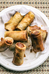 lots of spring roll shrimp fresh fried snack malaysia thailand close-up vertical photo