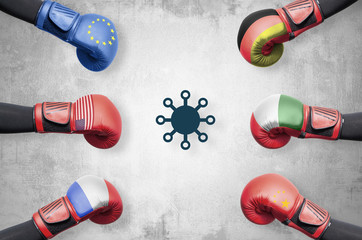 Fighting the world with coronavirus. Boxing gloves with flags of different countries like the US,...