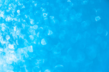 Abstract blue background with bokeh. Gradient glare from left to right. Horizontal background.