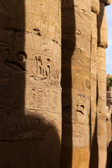 Karnak Temple, complex of Amun-Re. Embossed hieroglyphics on columns. Great Hypostyle Hall. Luxor...