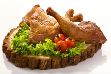 Roast chicken legs isolated on white background