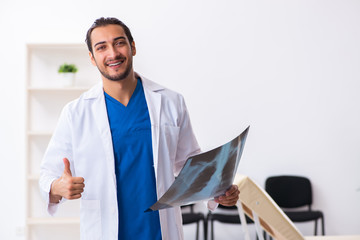 Young male doctor working in the clinic