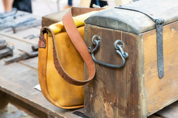 wooden old box weathered wrought iron handles leather bag yellow set travel medieval baggage