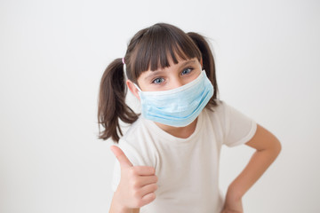 Kid With Medical Face Mask. White Background photo.