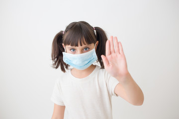 Little girl with medical face mask