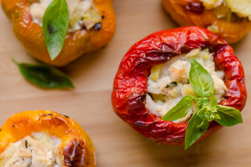 peppers stuffed with chicken with potatoes and spices. red green, yellow, vegan food