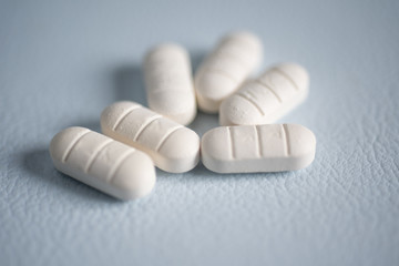 Close up white pills anti viral.