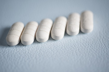 Close up white pills anti viral.
