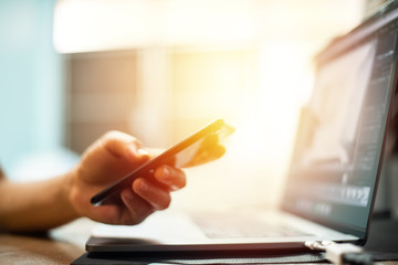 Hand with credit card with laptop shopping online concept.