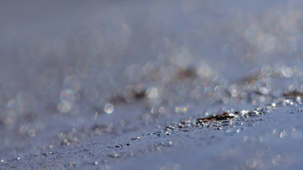 Abstract macro photography – Metallic bokeh light on a steel surface