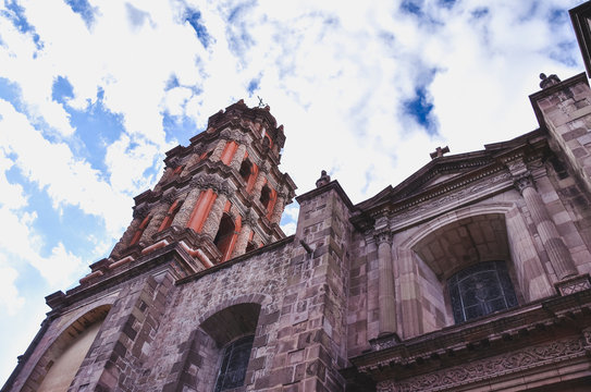 Aranzazu chapel a llok to its bell tower under the blue sky