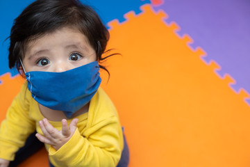 Portrait  baby boy wearing dust mask protect for  coronavirus or covid-19 infectious disease 