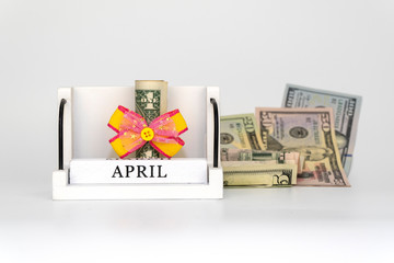 perpetual calendar with wooden cubes. celebrating the birthday of the dollar on April 01.
