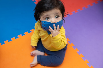Portrait  baby boy wearing dust mask protect for  coronavirus or covid-19 infectious disease 