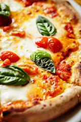 Pizza margherita, tomato and basil 