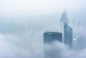 Skyscraper through the fog in Hong Kong city - Powered by Adobe