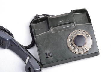 old dirty disc telephone isolated on a white background