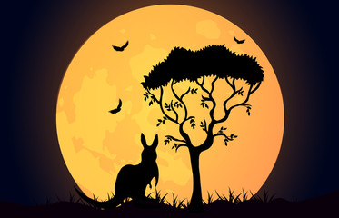 Kangaroo silhouette on the Australian plains. Acacia tree and kangaroo with birds on the background of the moon.