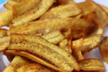 Banana chips in a white plate, salty and spicy, Indian snack