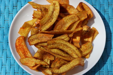 Banana chips in a white plate, salty and spicy, Indian snack