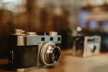 Fototapeta na wymiar Vintage film camera, collectibles. retro photography equipment. vintage color tone.