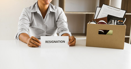 Female employee is about to submit a resignation at his office.