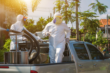 Public health officer is spraying chemicals as a prevention against Coronavirus disease 2019,...