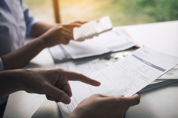 Two asian couples and men and women are together analyzing expenses or finances in deposit accounts and daily income sources with an savings economical concept.