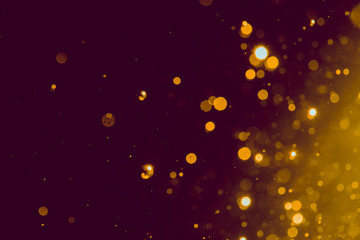 Fototapeta na wymiar Abstract gold blur glitter bokeh on black