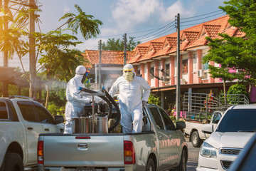 Public health officer is spraying chemicals as a prevention against Coronavirus disease 2019,...