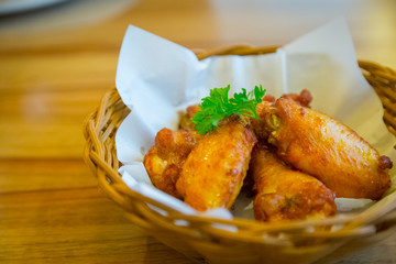 Chicken wings barbecued in a basket
