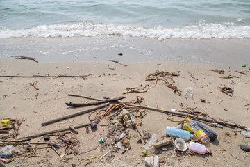 Plastic junk garbage dirty on the beach environment pollution
