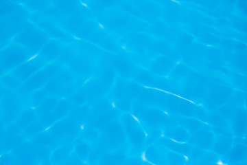 Blue water ripple reflection in the swimming pool