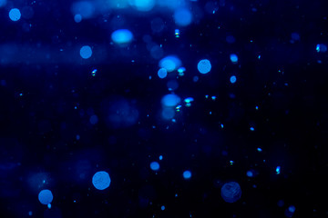 Obraz na płótnie Canvas Blur blue bokeh of light on black