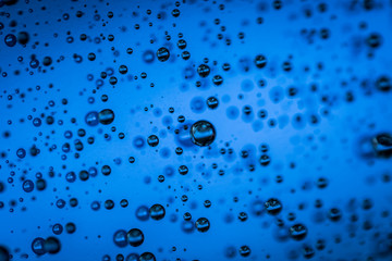 Water droplets on blue