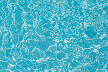 Blue water ripple reflection in the swimming pool
