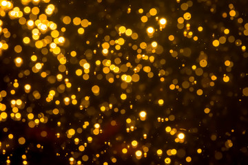 Fototapeta na wymiar Golden blur glitter lights abstract bokeh for Merry Christmas and New Year