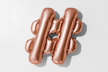 Hashtag symbol or  , Rose gold foil balloon alphabet isolated on a white background with Clipping Path © SEE D JAN