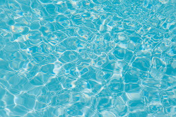 Blue water ripple reflection in the swimming pool