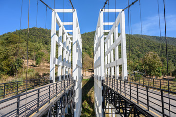 An iconic white bridge in Mae Kuang Dam, Chiang Mai province of Thailand. Mae Kuang dam is a medium-sized reservoir used to facilitate water into the city’s water supply.