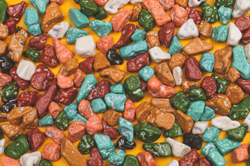 Candy pebbles background. sweets in the form of colored stones