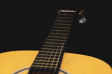 Acoustic guitar close up. musical instrument. strings on the guitar neck