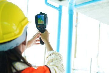 Inspector or engineer scan building to inspect with scanning camera