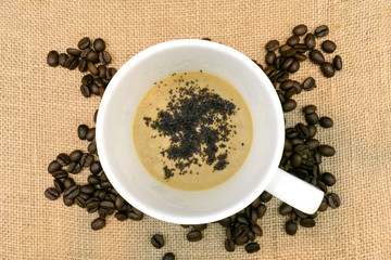 cup of coffee with coffee beans