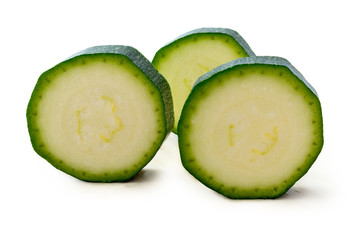 fresh green zucchini slices isolated on white