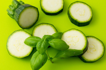 fresh green zucchini slices on green